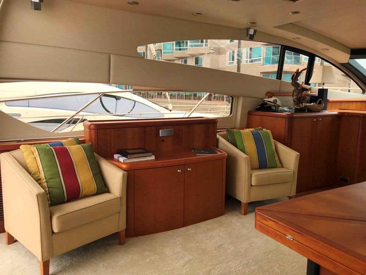 a room with a couch and a table and a chair aboard DAY DREAMER Yacht for Sale