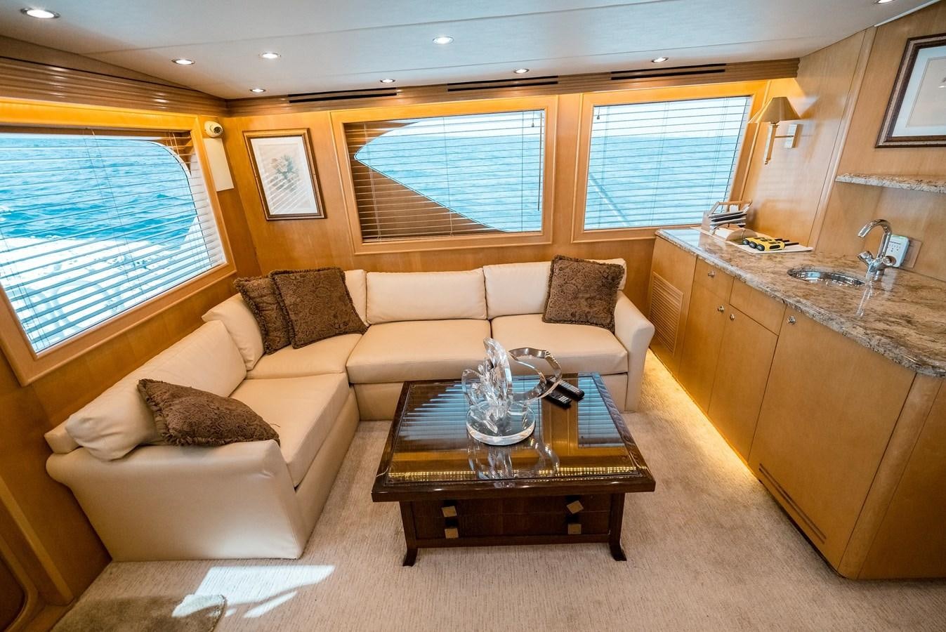 a living room with a couch and a coffee table aboard JUST LIKE THAT Yacht for Sale