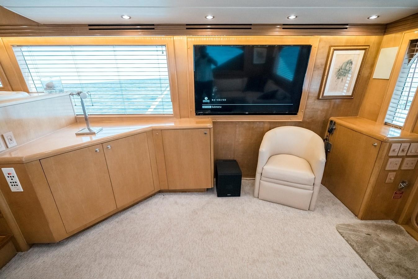 a room with a tv and a couch aboard JUST LIKE THAT Yacht for Sale