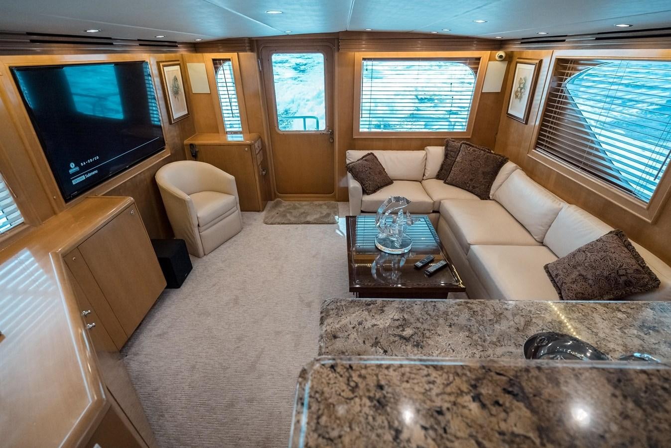 a living room with a couch and a tv aboard JUST LIKE THAT Yacht for Sale