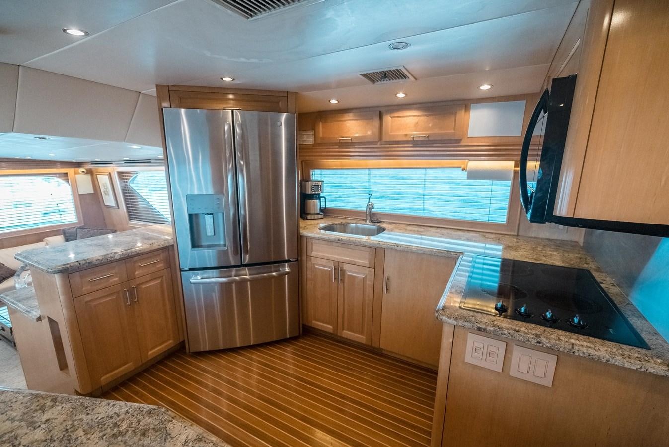 a kitchen with a large refrigerator aboard JUST LIKE THAT Yacht for Sale