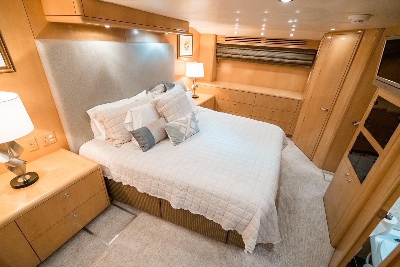 a bed with a white comforter aboard JUST LIKE THAT Yacht for Sale