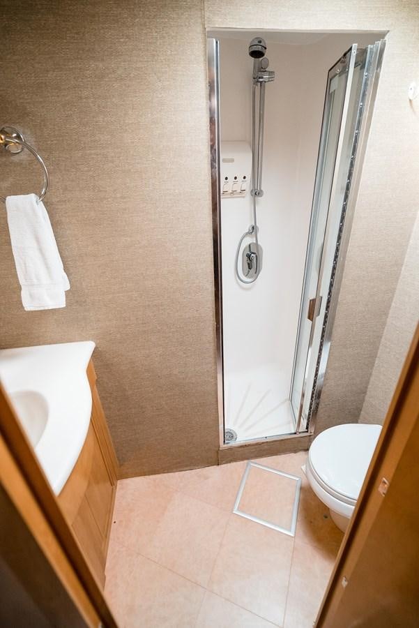 a bathroom with a shower and sink aboard JUST LIKE THAT Yacht for Sale