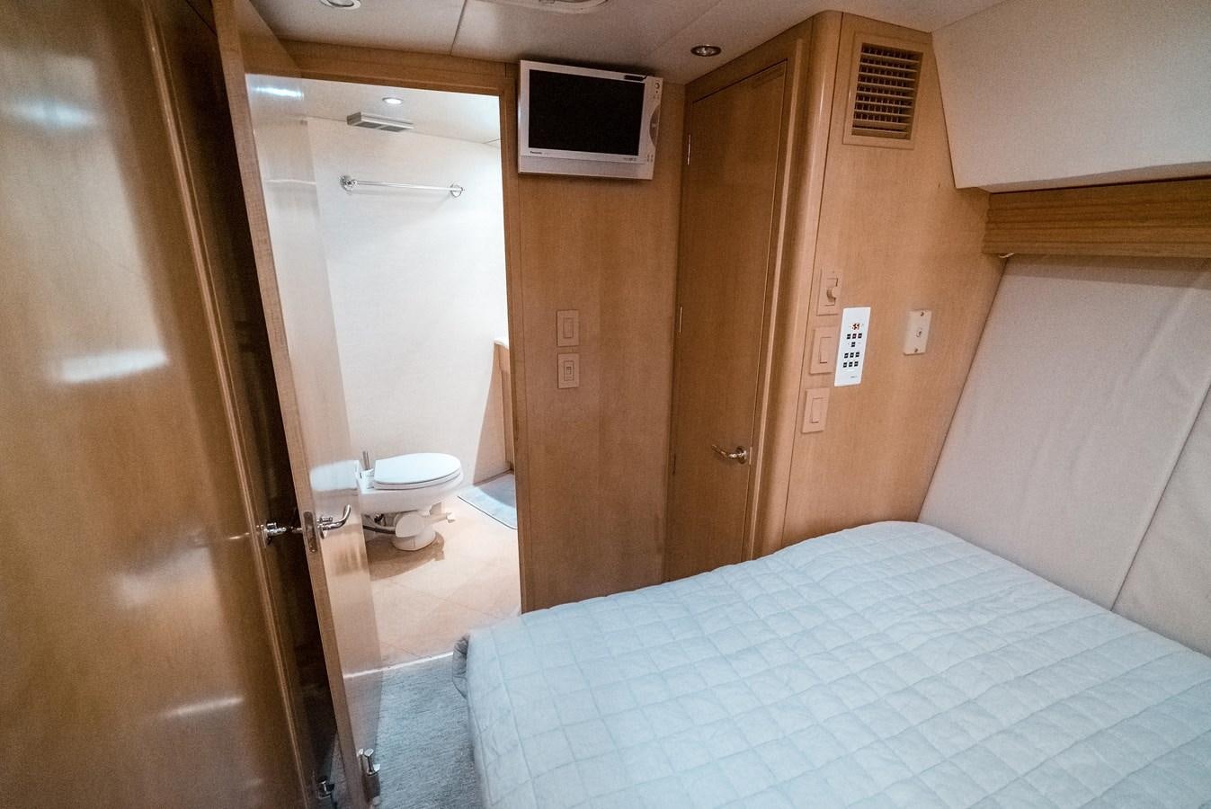 a bedroom with a bed aboard JUST LIKE THAT Yacht for Sale