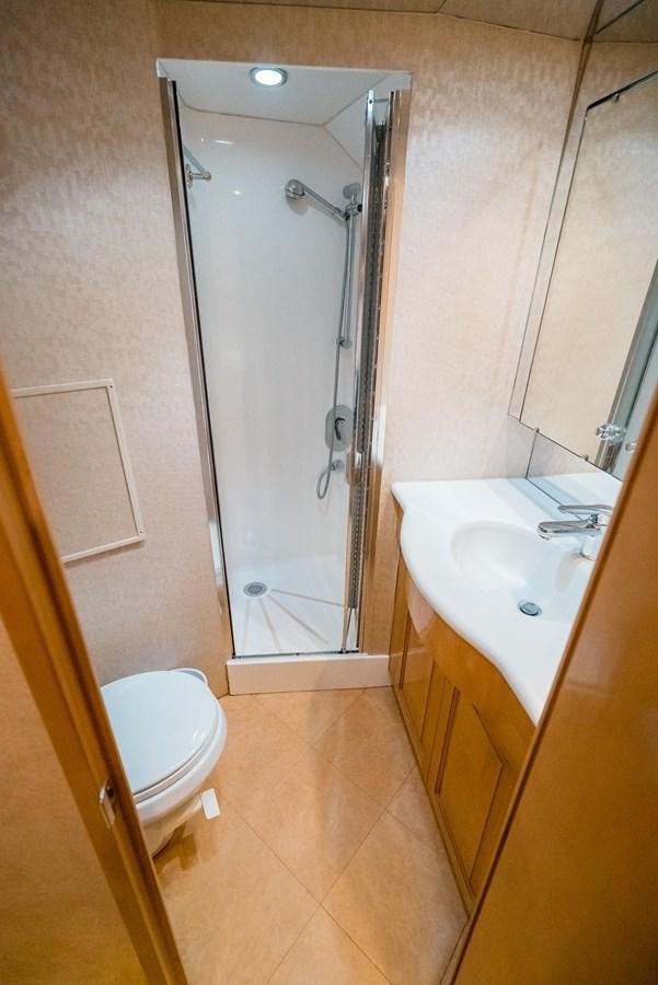 a bathroom with a glass shower door aboard JUST LIKE THAT Yacht for Sale