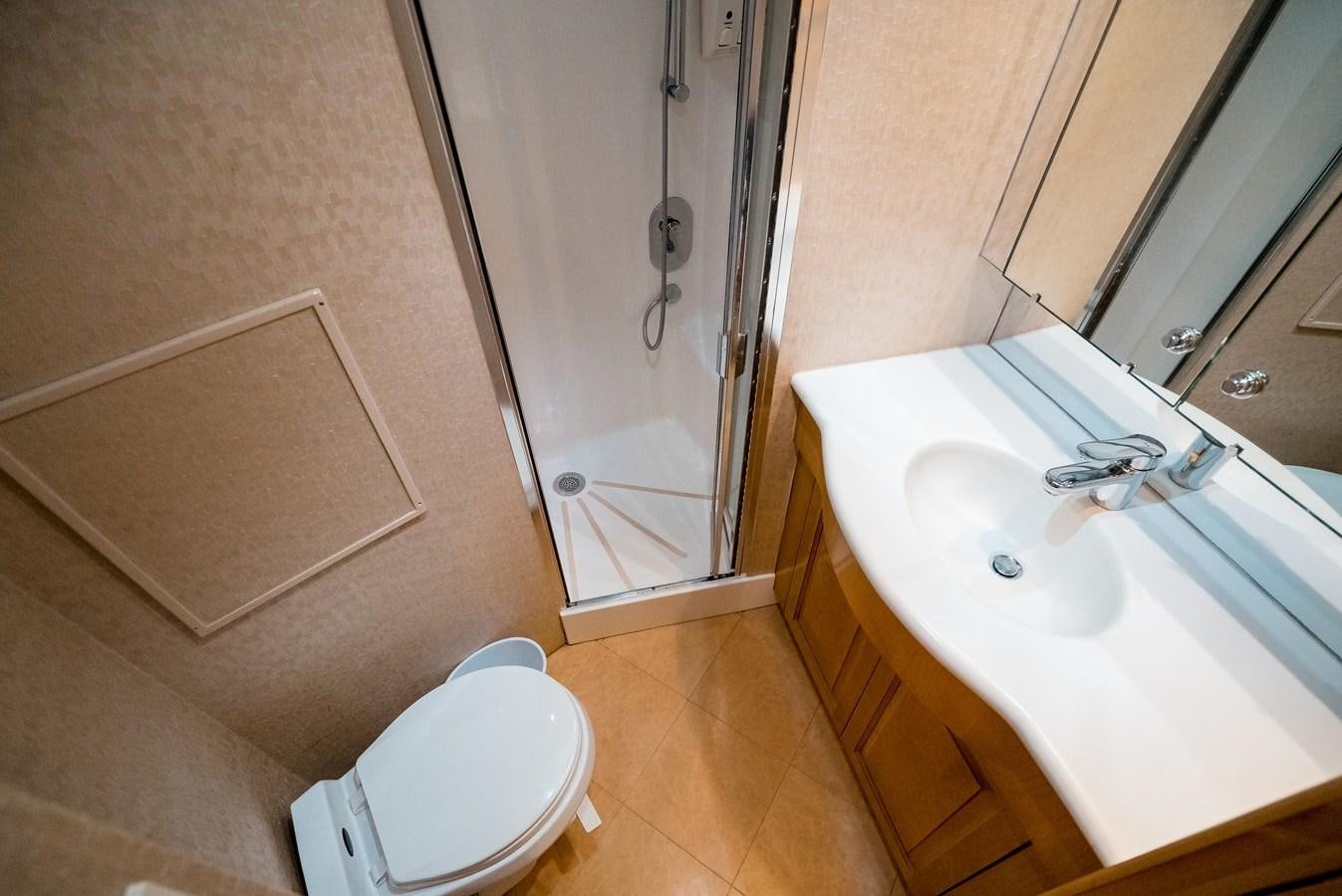 a bathroom with a sink and a toilet aboard JUST LIKE THAT Yacht for Sale