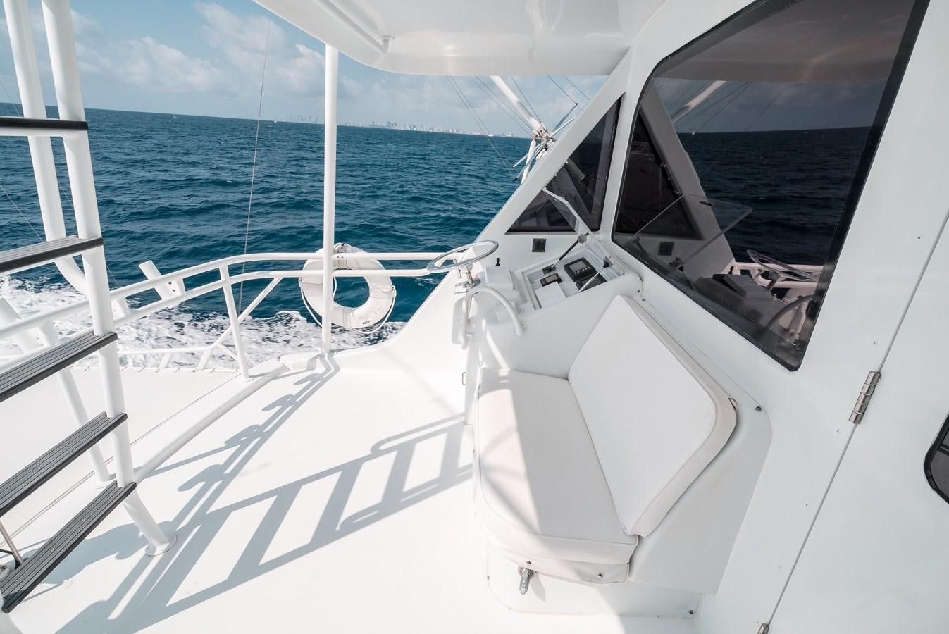 a white boat on the water aboard JUST LIKE THAT Yacht for Sale