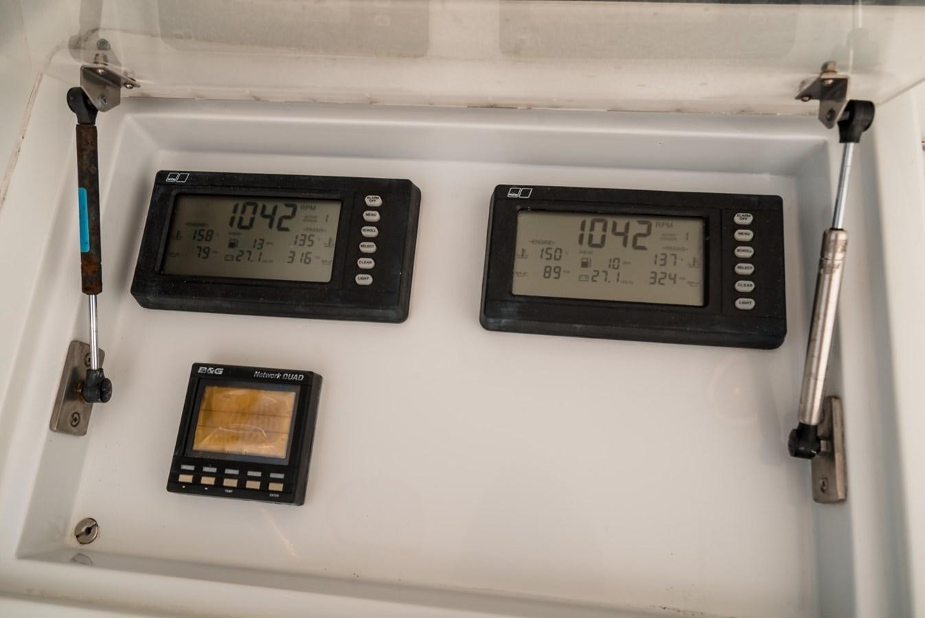 a white machine with a black dial and a black rectangular object aboard JUST LIKE THAT Yacht for Sale