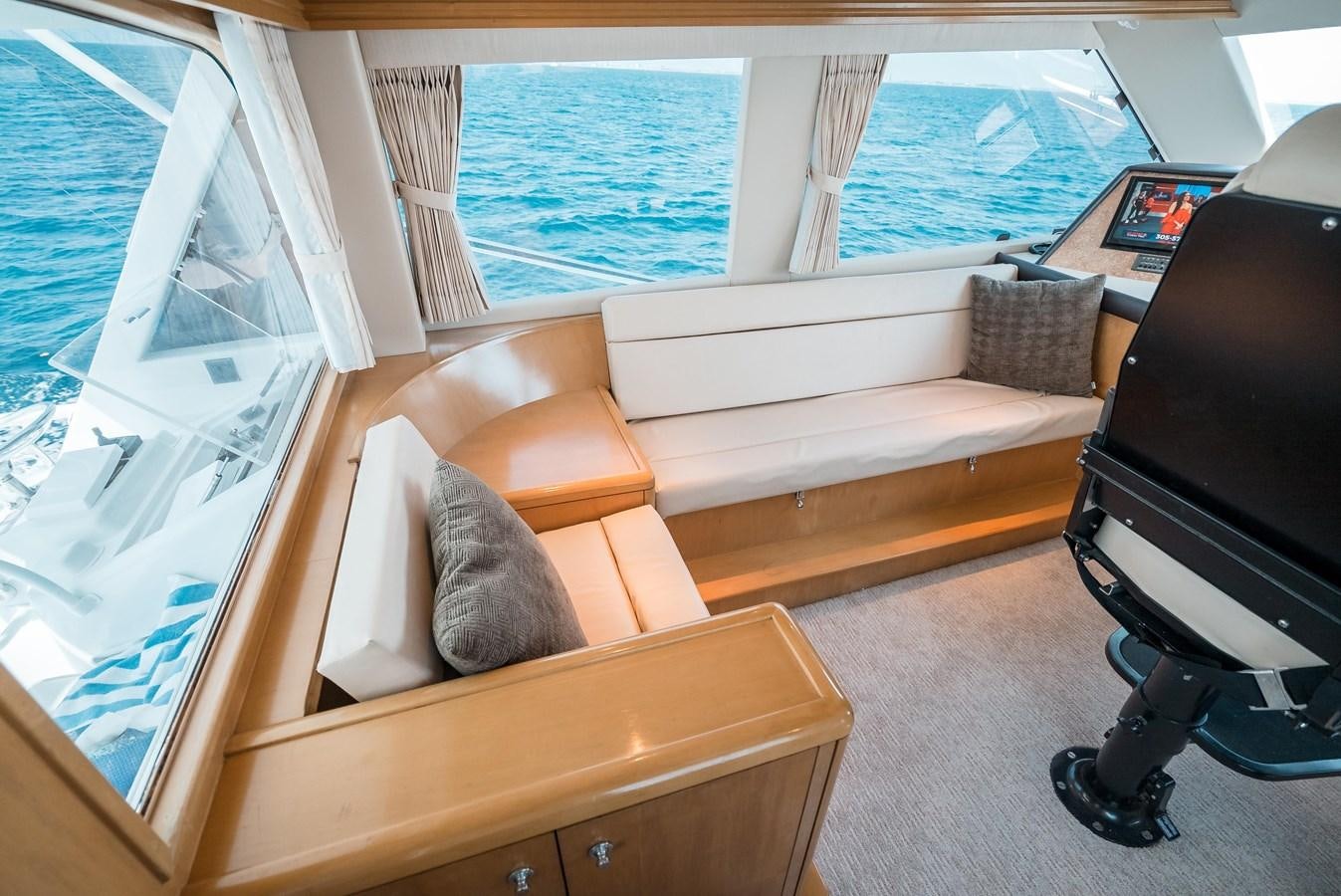 a cat on a couch aboard JUST LIKE THAT Yacht for Sale