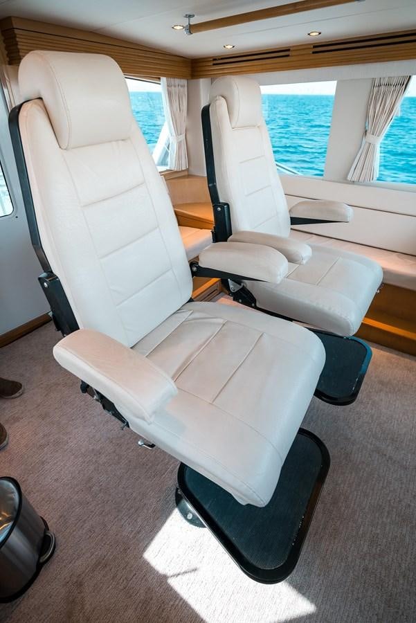 a room with chairs and a table aboard JUST LIKE THAT Yacht for Sale