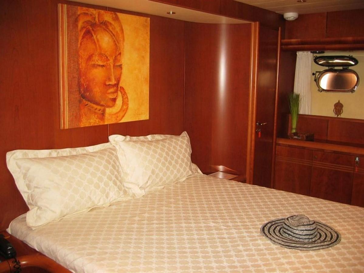 a bed with a white sheet aboard CACAO BAY Yacht for Sale
