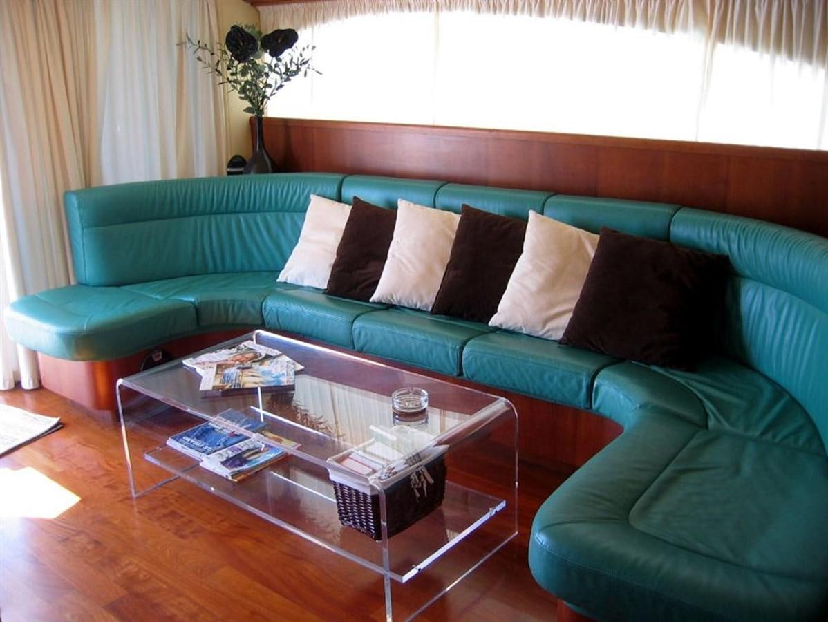 a living room with a couch and coffee table aboard CACAO BAY Yacht for Sale