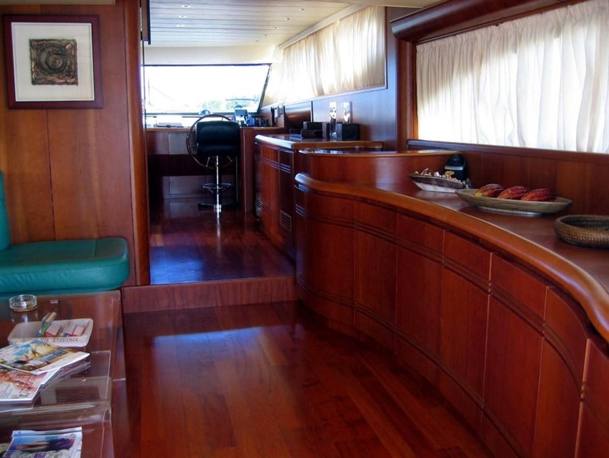 a kitchen with a table and chairs aboard CACAO BAY Yacht for Sale