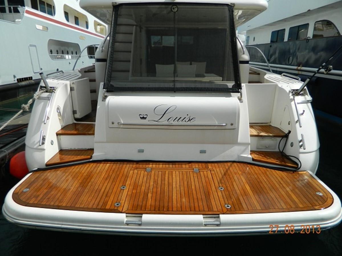 the back of a white car aboard LOUISE Yacht for Sale