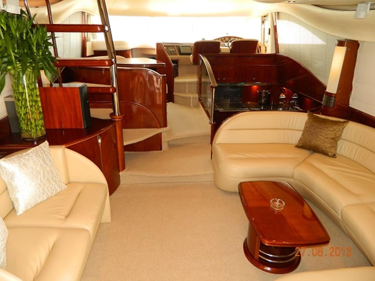 a room with a couch and a piano aboard LOUISE Yacht for Sale