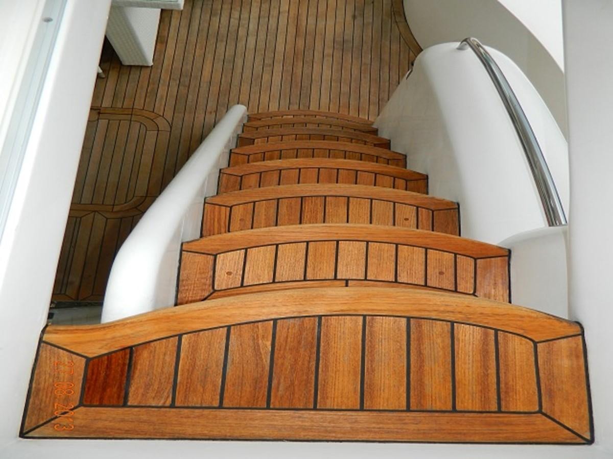 a staircase with a white railing aboard LOUISE Yacht for Sale