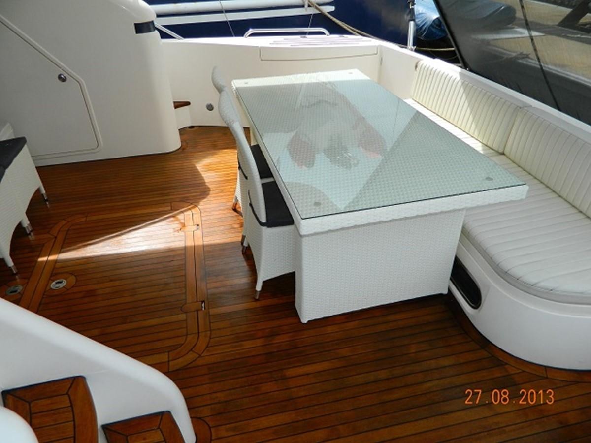 a white bed with a white sheet aboard LOUISE Yacht for Sale