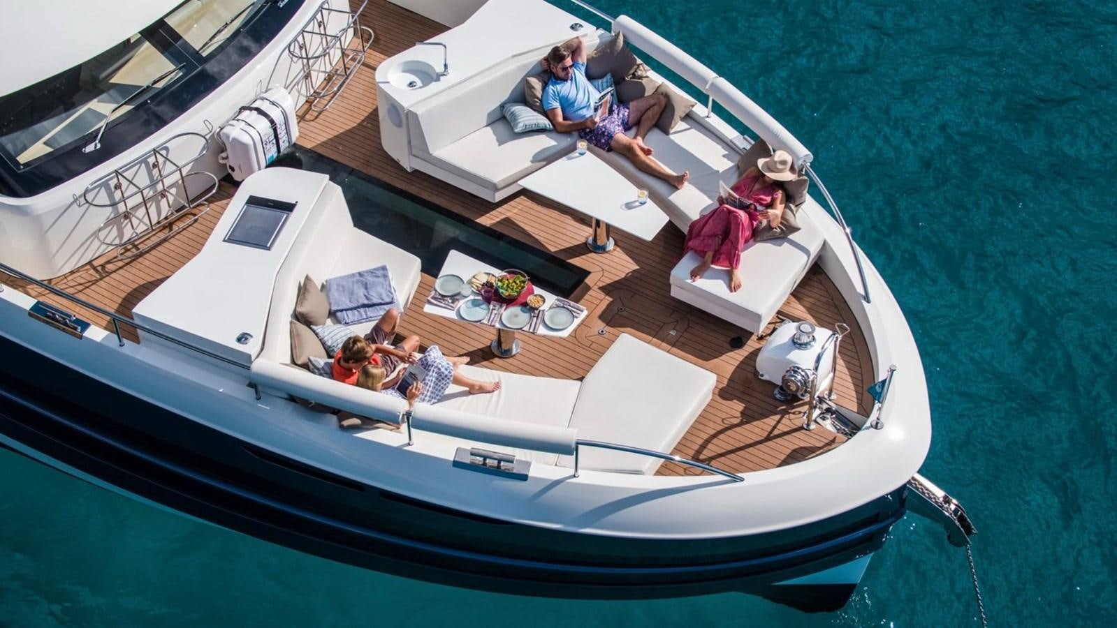 a boat with people on it aboard VAN DER VALK BEACHCLUB 660 FLYBRIDGE Yacht for Sale