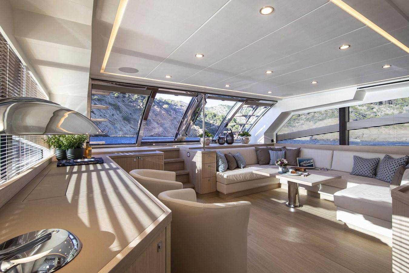 a large living room with a large window aboard VAN DER VALK BEACHCLUB 660 FLYBRIDGE Yacht for Sale