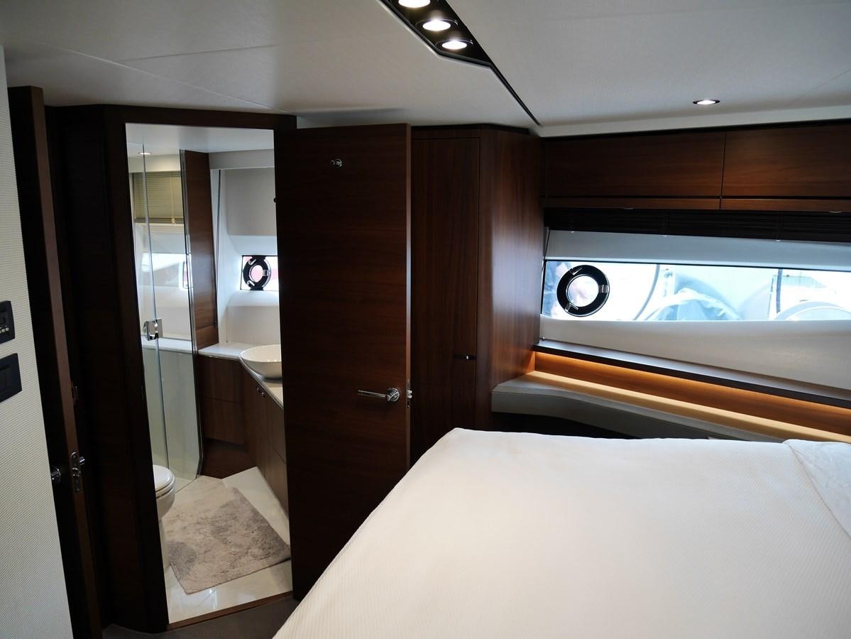 a bedroom with a large window aboard KATI Yacht for Sale