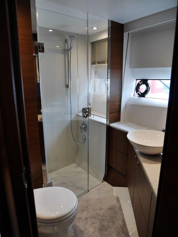 a bathroom with a glass shower aboard KATI Yacht for Sale