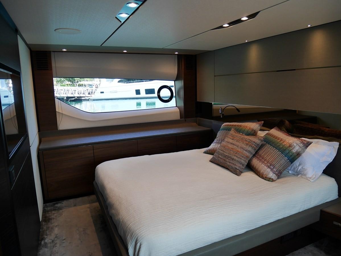 a room with a bed and a television aboard KATI Yacht for Sale