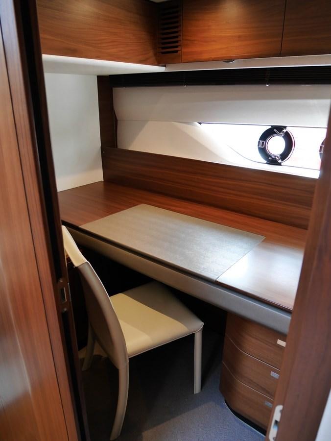 a chair and a desk in a room aboard KATI Yacht for Sale