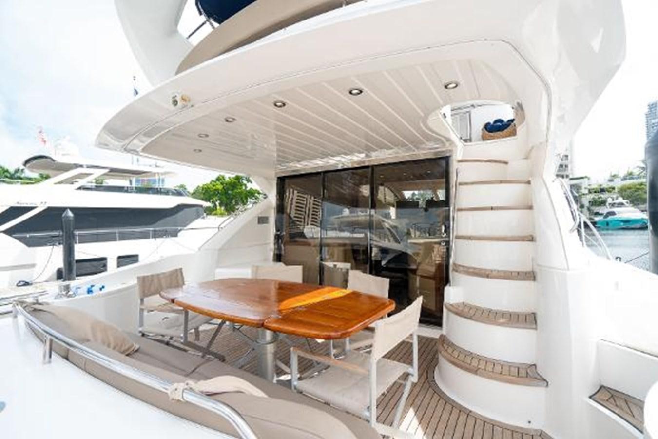 a boat with a table and chairs aboard SOLE MIO Yacht for Sale