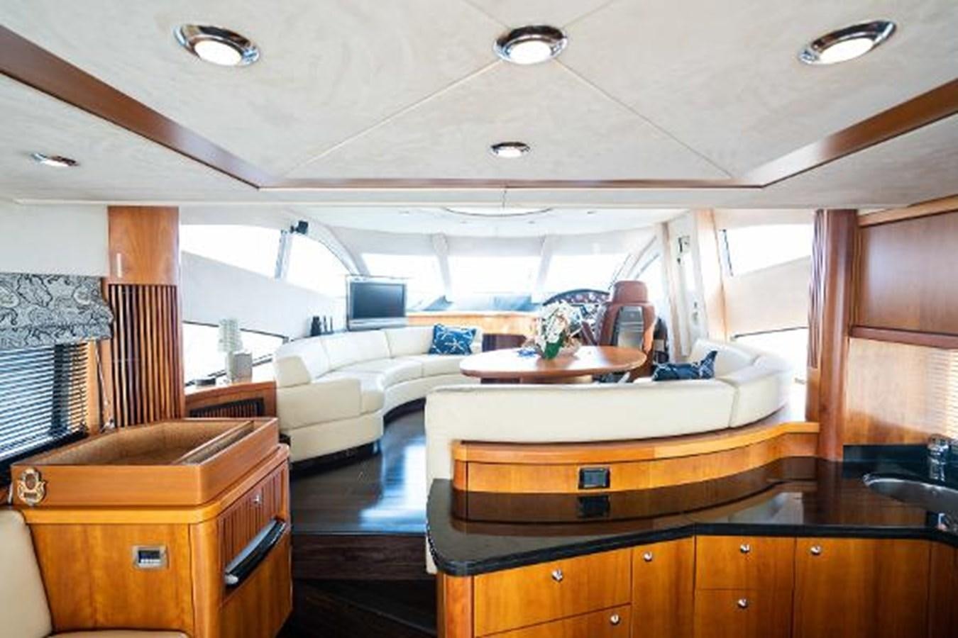 a living room with a large window aboard SOLE MIO Yacht for Sale