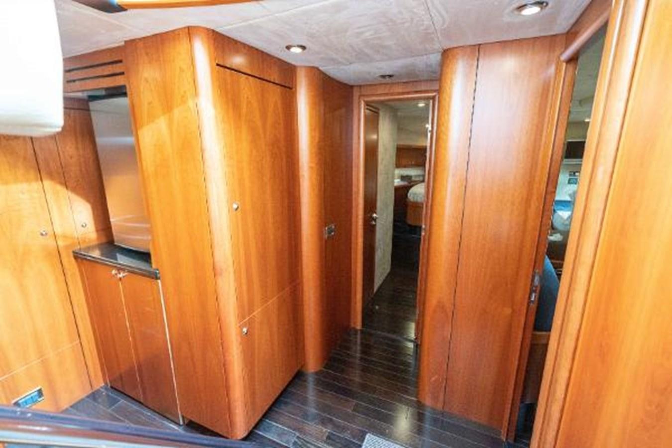 a room with wooden cabinets aboard SOLE MIO Yacht for Sale