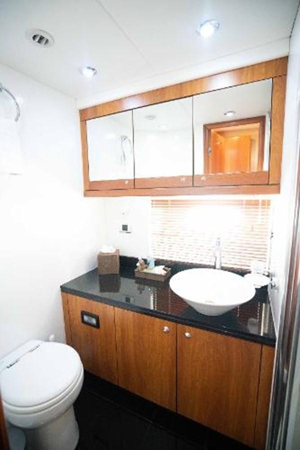 a bathroom with a sink and toilet aboard SOLE MIO Yacht for Sale