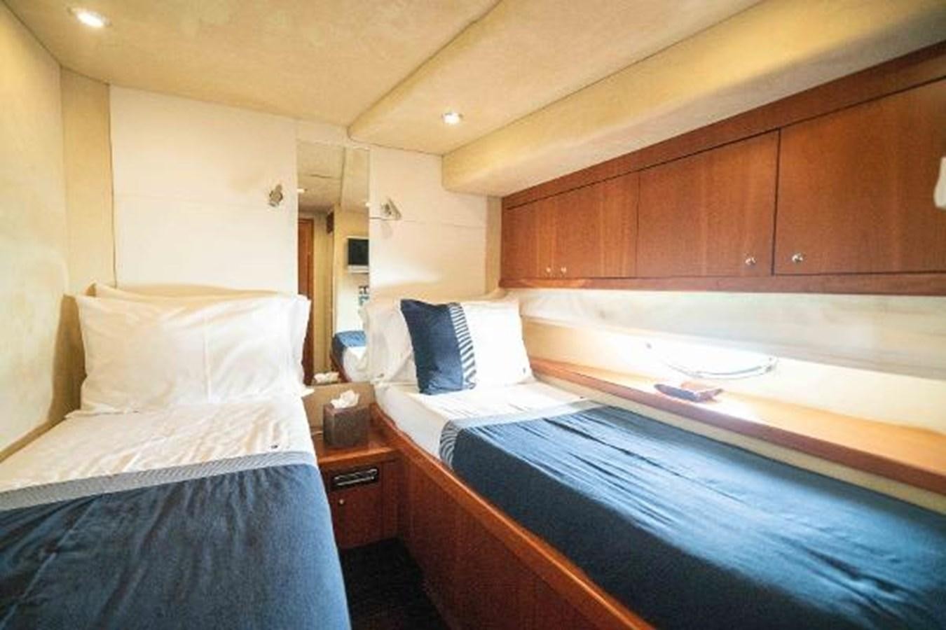 a room with two beds aboard SOLE MIO Yacht for Sale