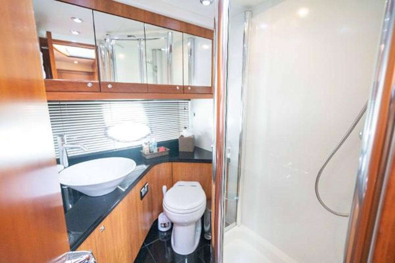 a bathroom with a sink and a toilet aboard SOLE MIO Yacht for Sale