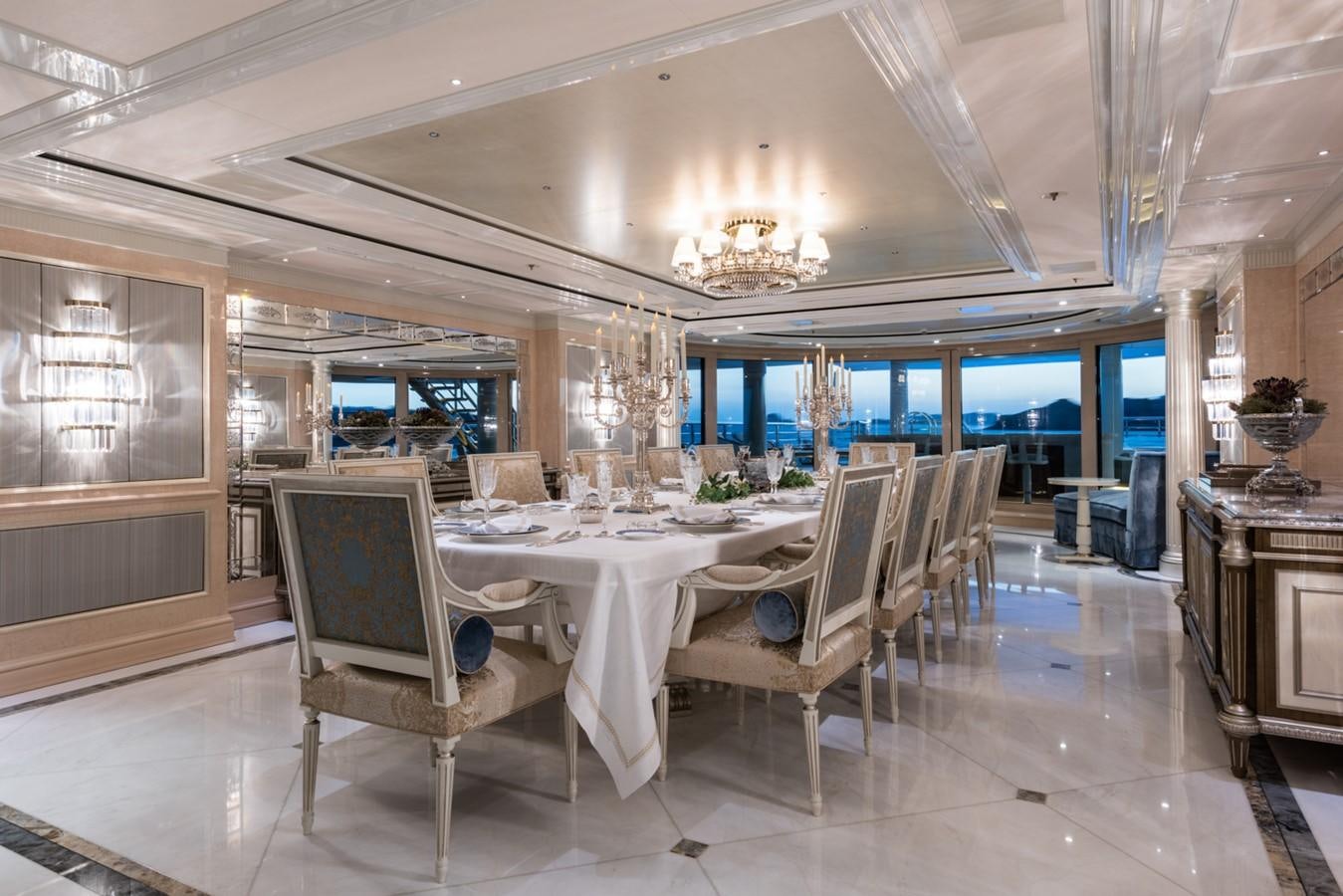 a large dining room with a large table and chairs aboard PLVS VLTRA Yacht for Sale