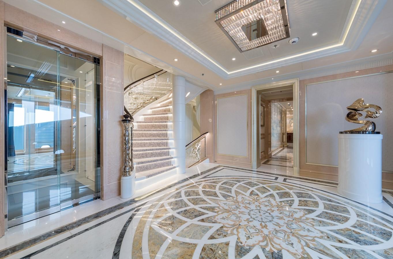 a large room with a glass door aboard PLVS VLTRA Yacht for Sale