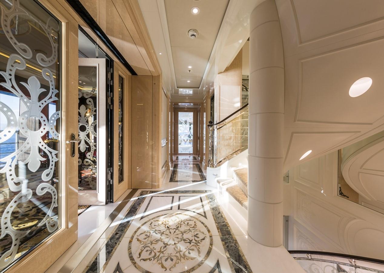 a large bathroom with marble tiles aboard PLVS VLTRA Yacht for Sale