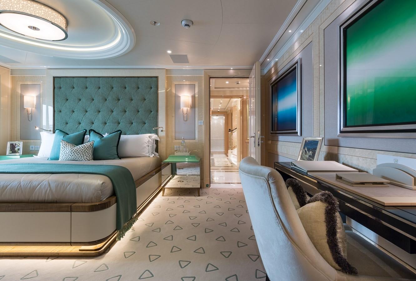 a room with a couch and a television aboard PLVS VLTRA Yacht for Sale