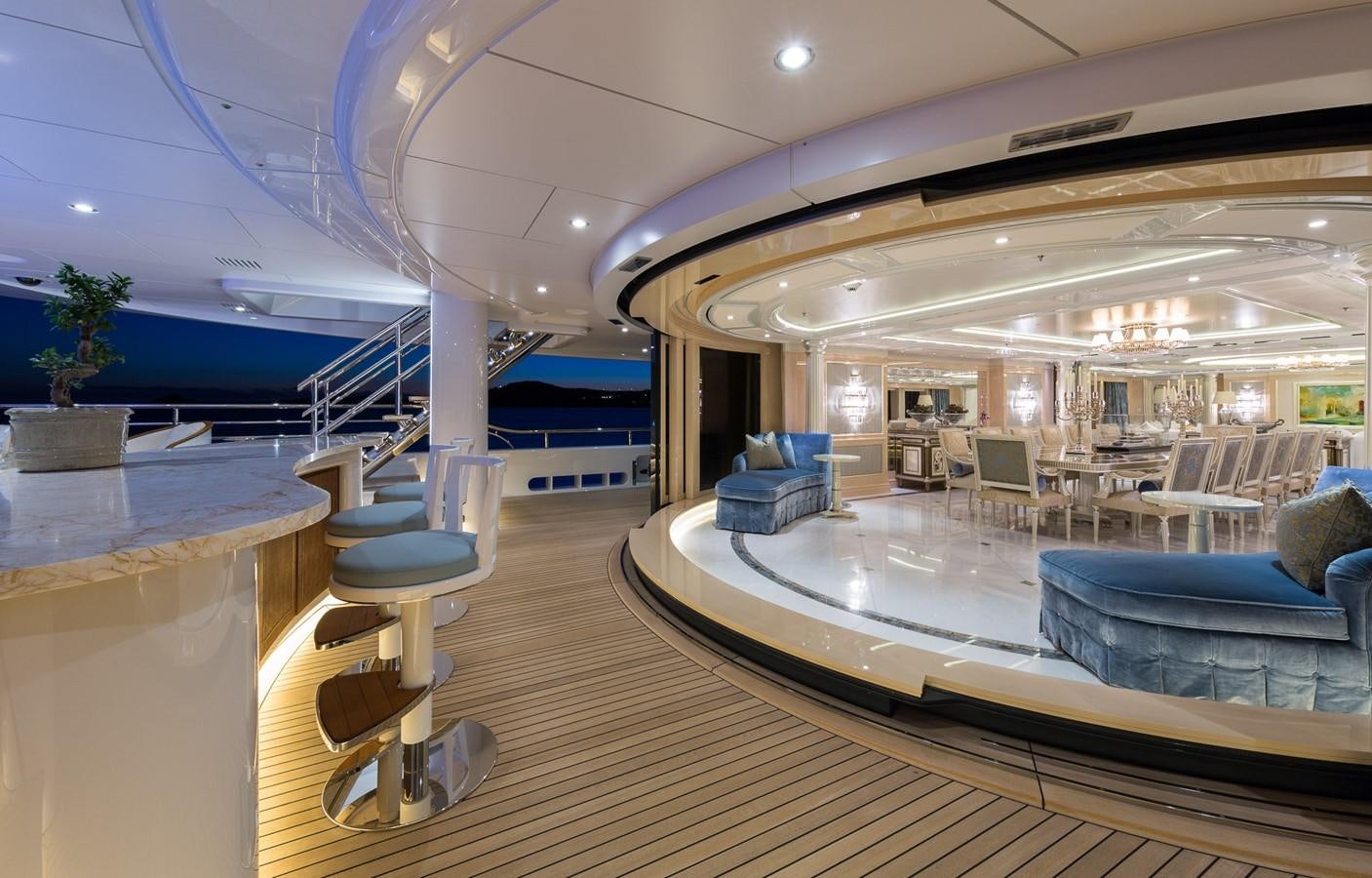 a large room with a pool table and chairs aboard PLVS VLTRA Yacht for Sale