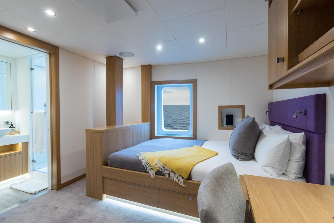 a bed in a room aboard GAME CHANGER Yacht for Sale