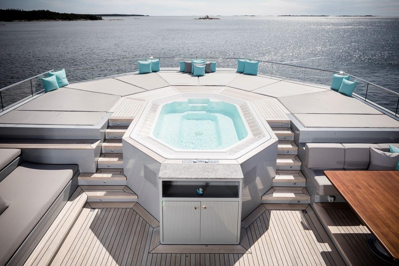 a deck with a pool aboard SKAT Yacht for Sale