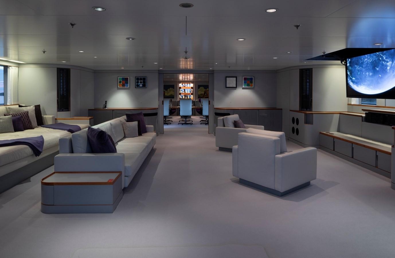 a room with couches and a table aboard SKAT Yacht for Sale