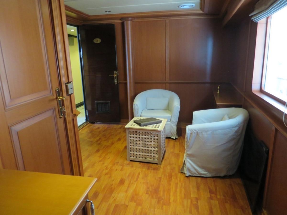 a room with a basket and a chair aboard ANDAMAN EXPLORER Yacht for Sale