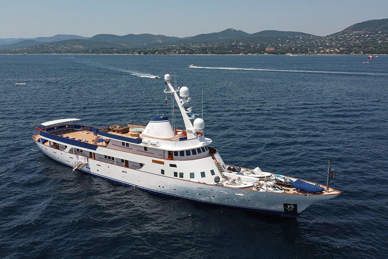 a large white boat in the water aboard PALOMA Yacht for Sale