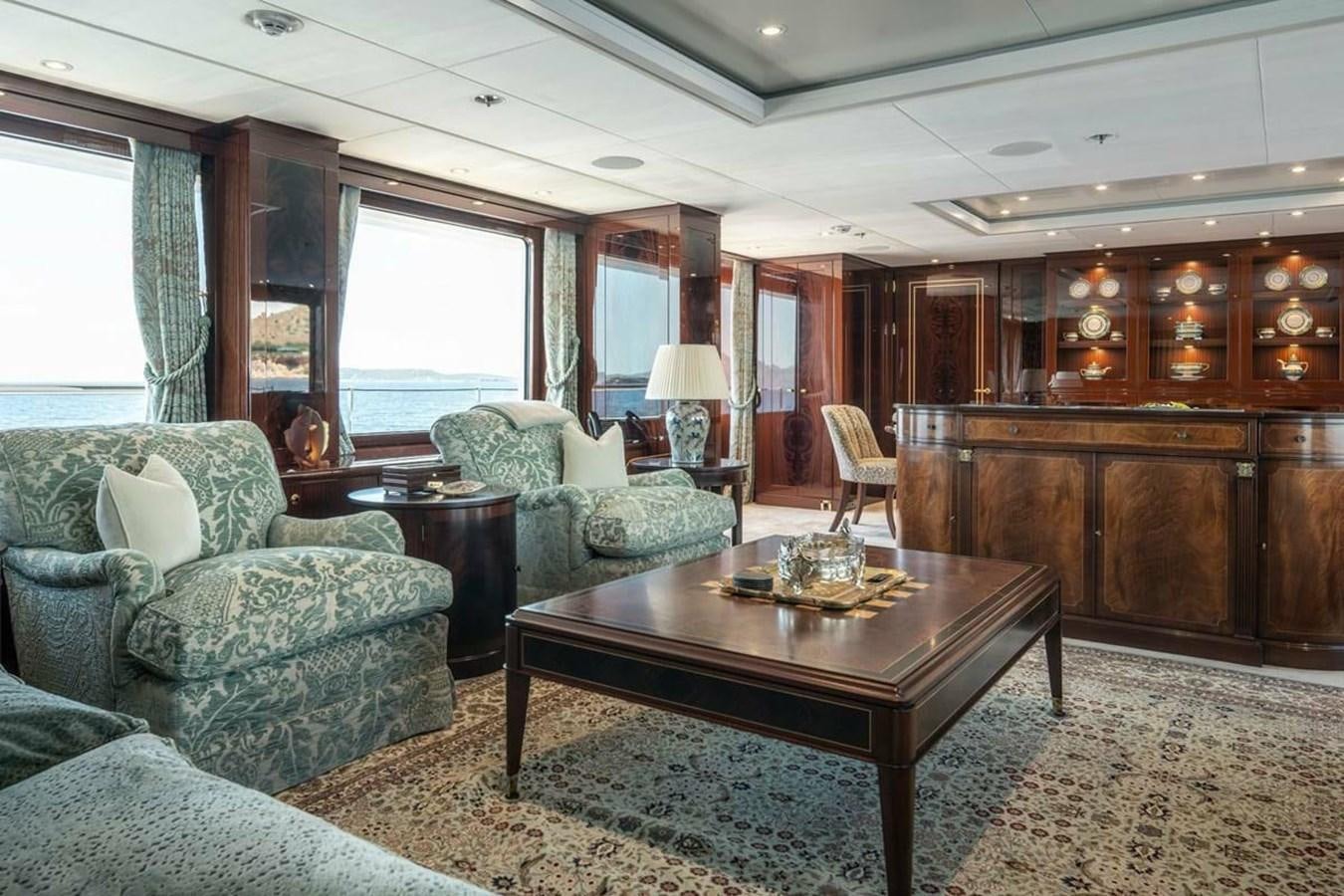 a living room with a couch and a coffee table aboard LA FAMILIA Yacht for Sale