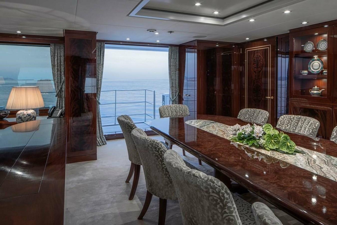 a living room with a large window aboard LA FAMILIA Yacht for Sale
