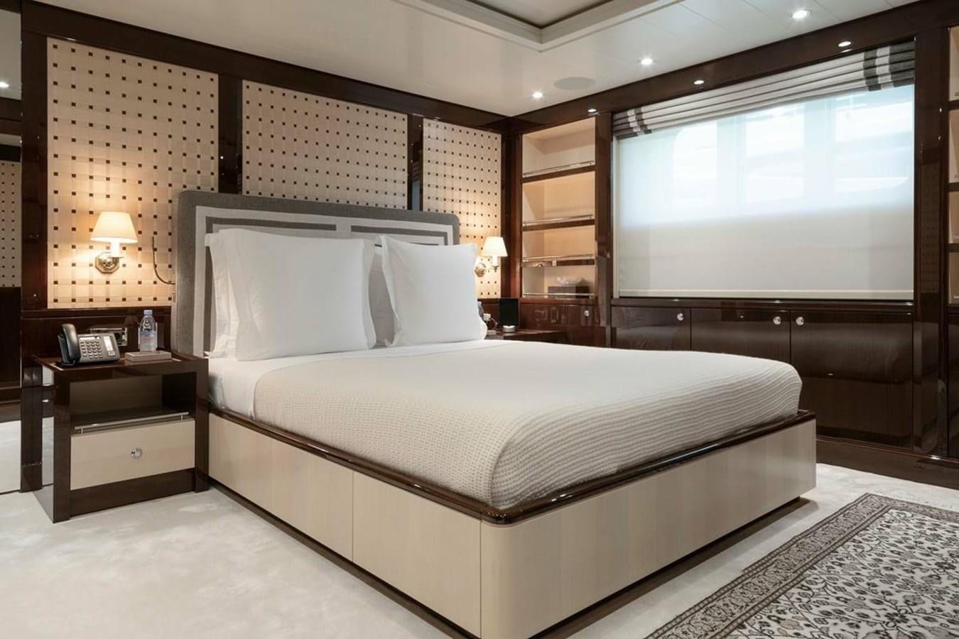 a large bed in a hotel room aboard LA FAMILIA Yacht for Sale