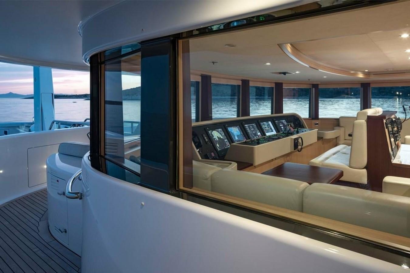a boat with a large window aboard LA FAMILIA Yacht for Sale