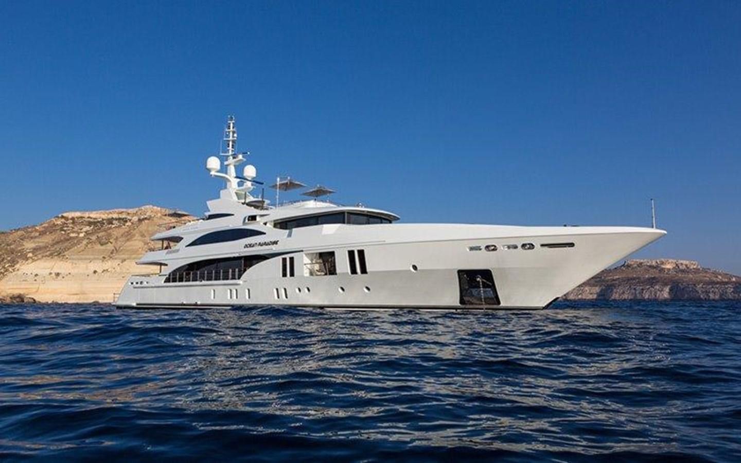a white boat in the water aboard OCEAN PARADISE Yacht for Sale
