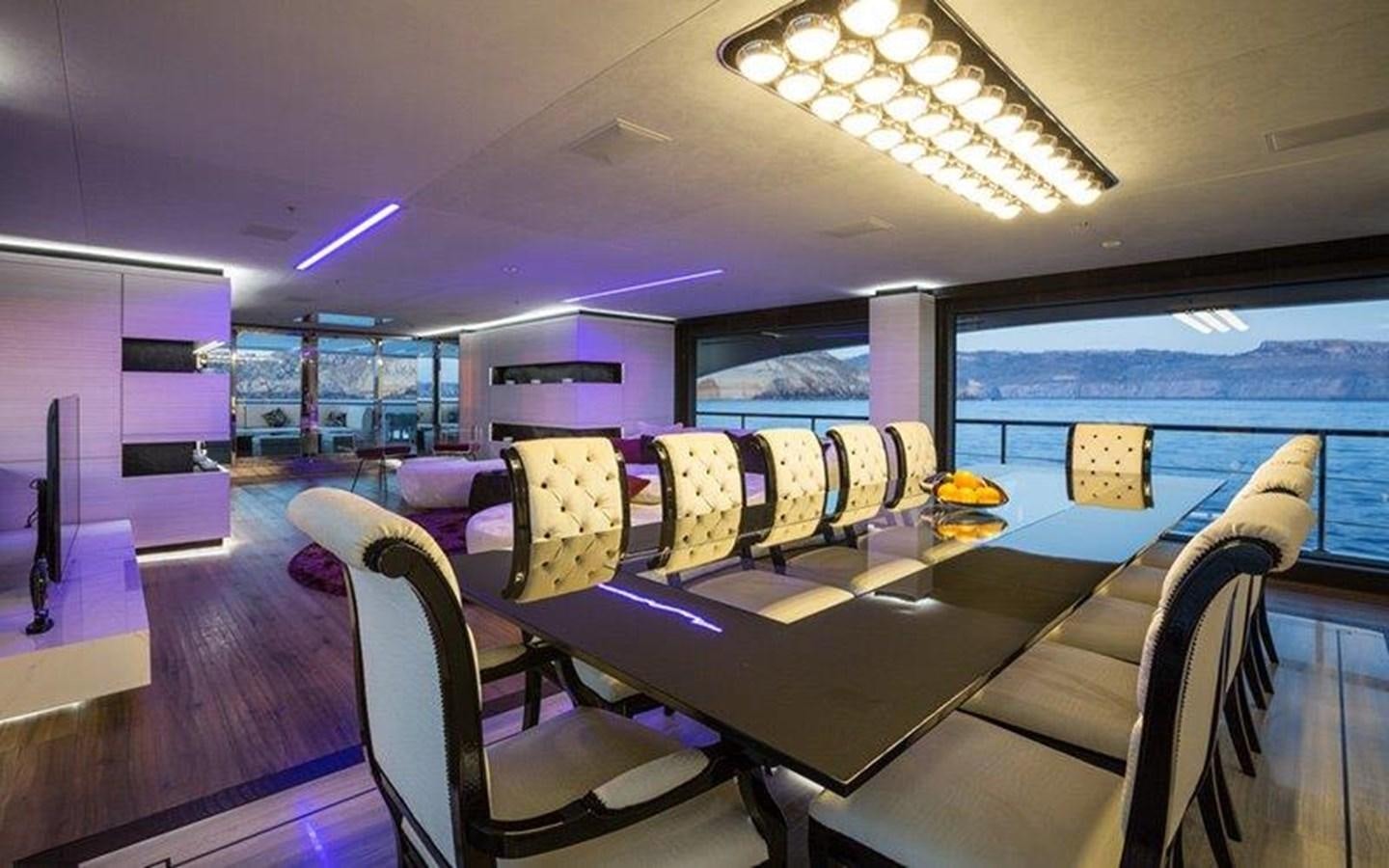 inside of a building with a pool table and chairs aboard OCEAN PARADISE Yacht for Sale
