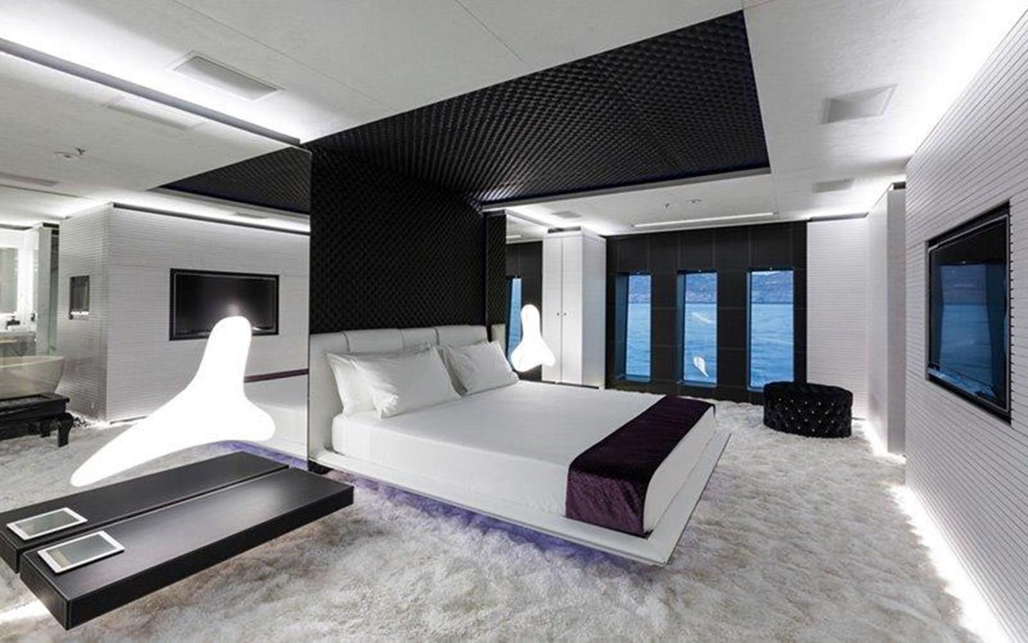 a large white bed in a room aboard OCEAN PARADISE Yacht for Sale